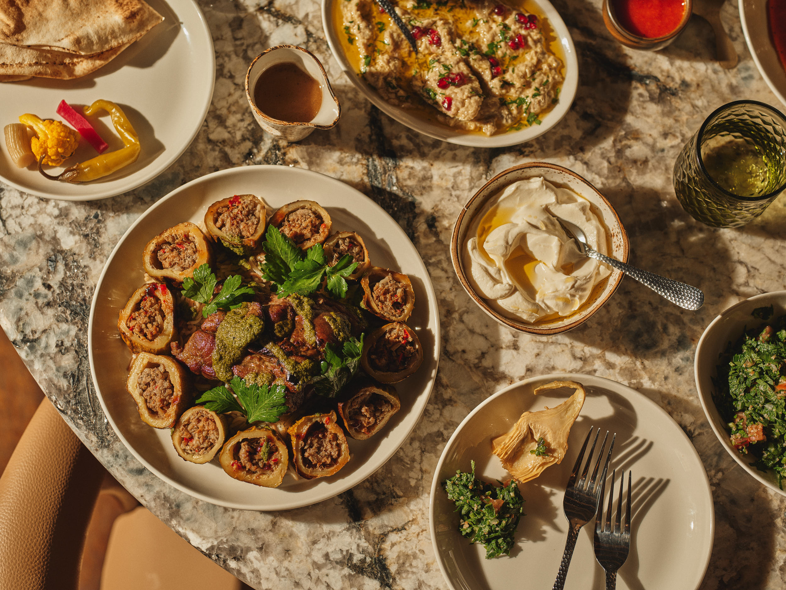 A Sahtein table spread with dips, vegetables, bread and shared Lebanese dishes